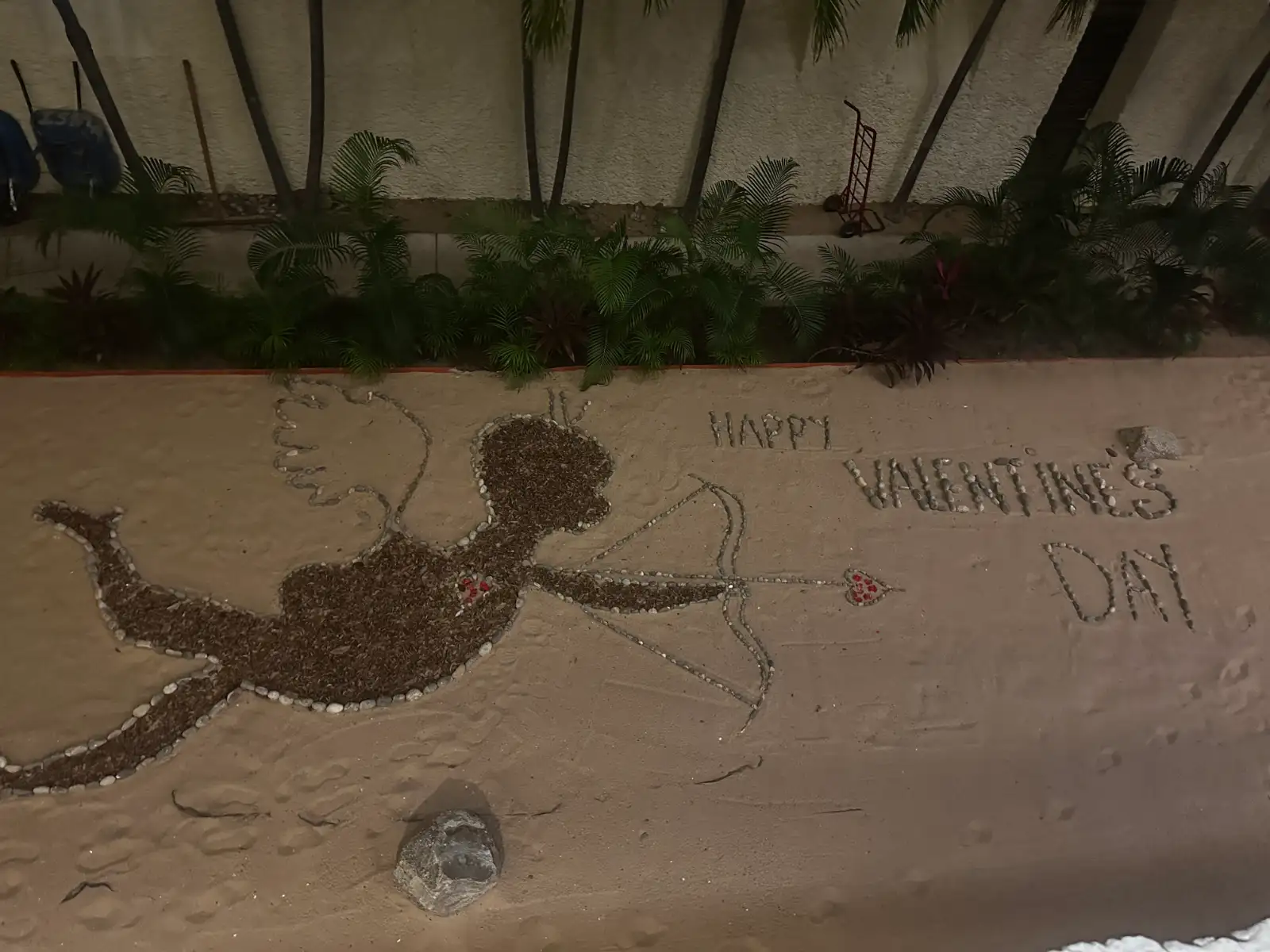 Valentines day message written in the sand looking from an upper floor.