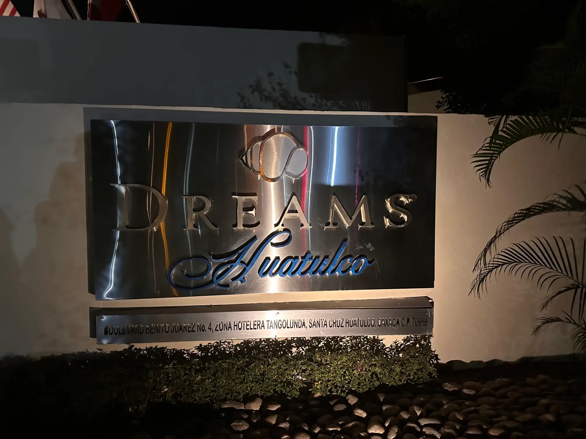 Dreams Huatulco sign at night