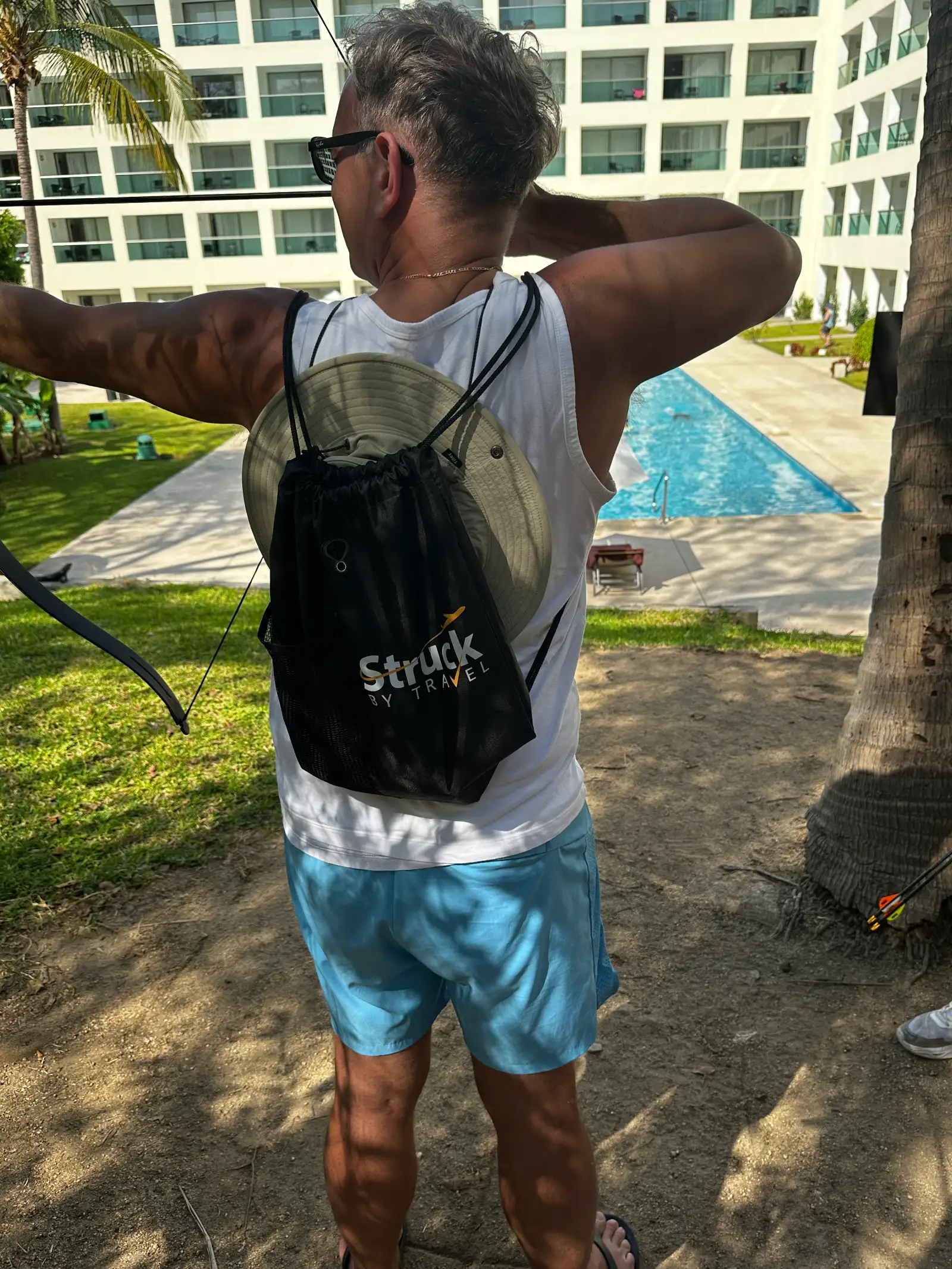 Behind the shades — Luka taking an archery lesson at Dreams Huatulco