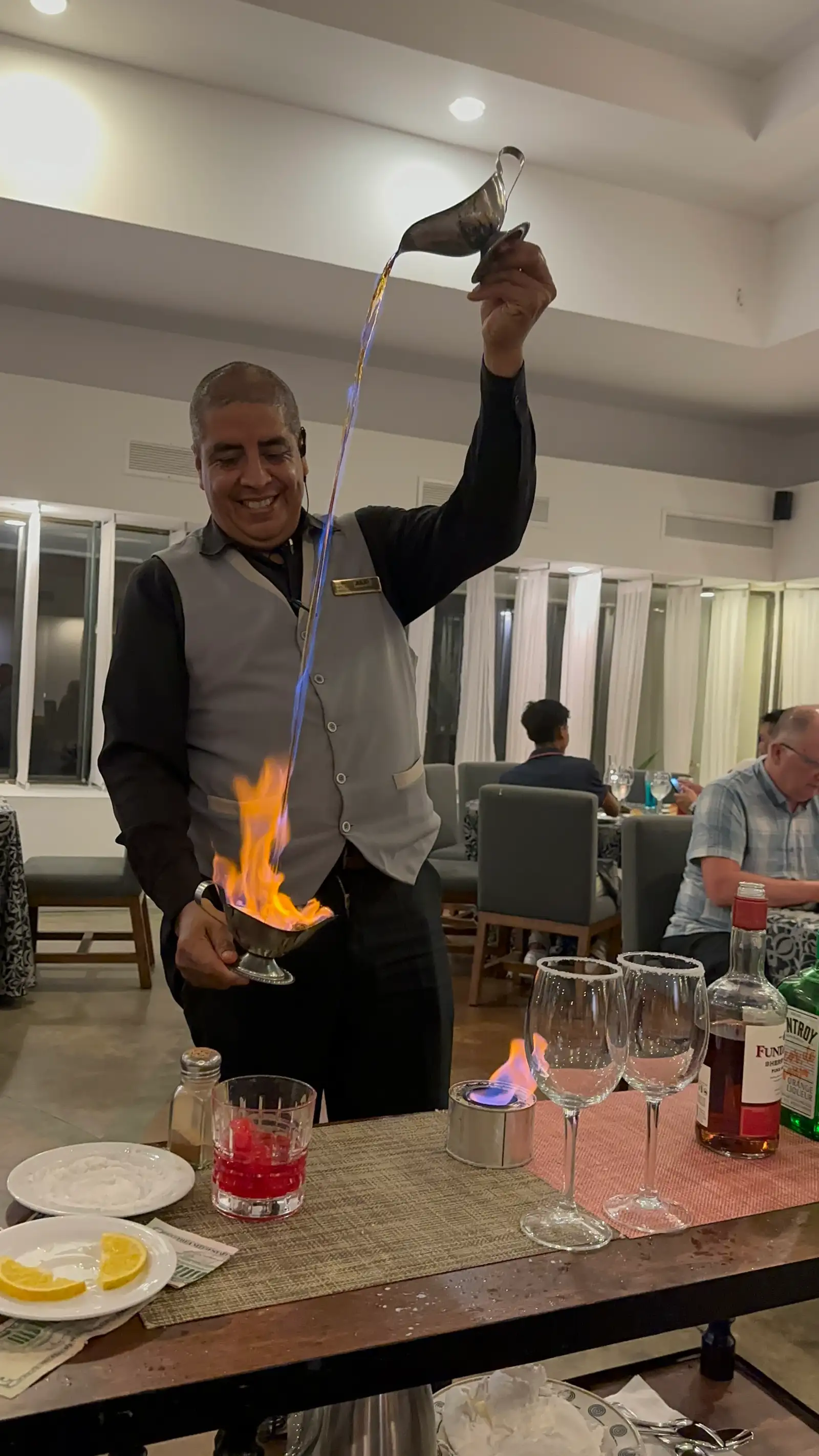 A waiter performing the Spanish coffee show at the Italian restaurant